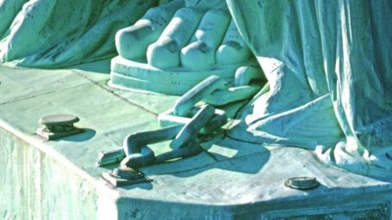 Chains on Statue’s feet.