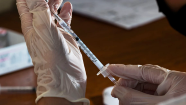 A Medical Professional prepares Pfizer vaccine