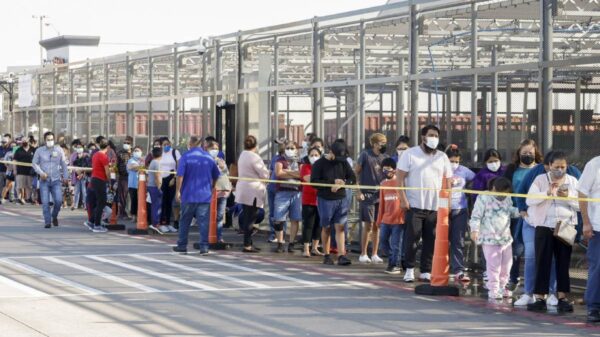 People wait in line at a COVID-19 vaccination