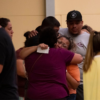 Women hug outside of the SSGT Willie