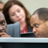 Dallas City Manager T.C. Broadnax, left, listens to Mayor Eric Johnson