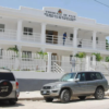 Residents walk past