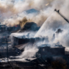 Fire fighters battle a grass fire