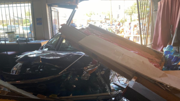Customer and car hit as building collapsed