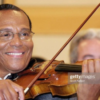 Minister Louis Farrakhan plays violin.