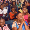 Attendees laugh during the Association of University Women