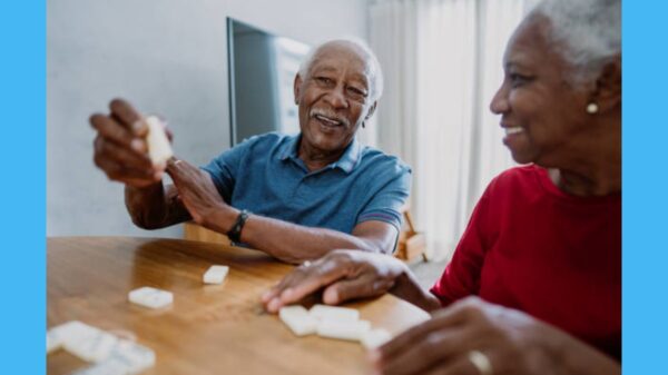 Senior couple playing dominoes