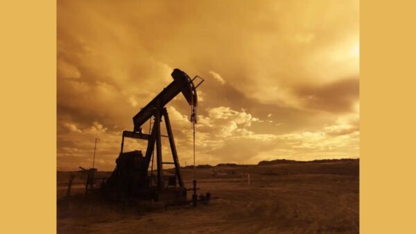 oil-pump-jack-sunset-clouds-silhouette