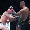 (R-L) Leon Edwards of Great Britain kicks Colby Covington