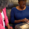 Giselle looking at a family photo album