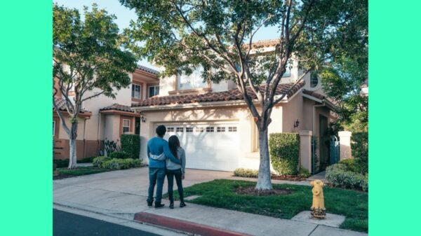 Couple in front of house