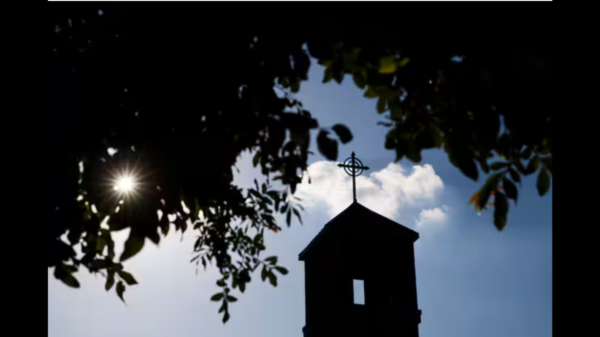 A Dallas priest is accused of inappropriately touching two children, police said Tuesday.