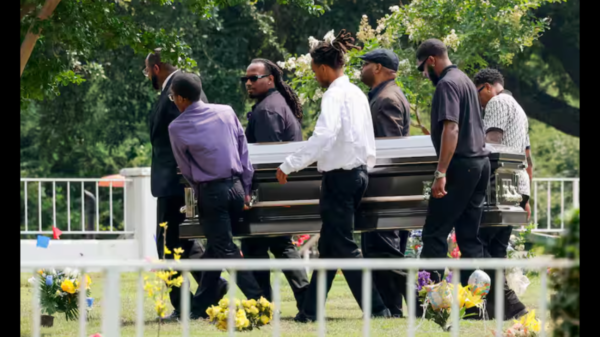 Pallbearers carry