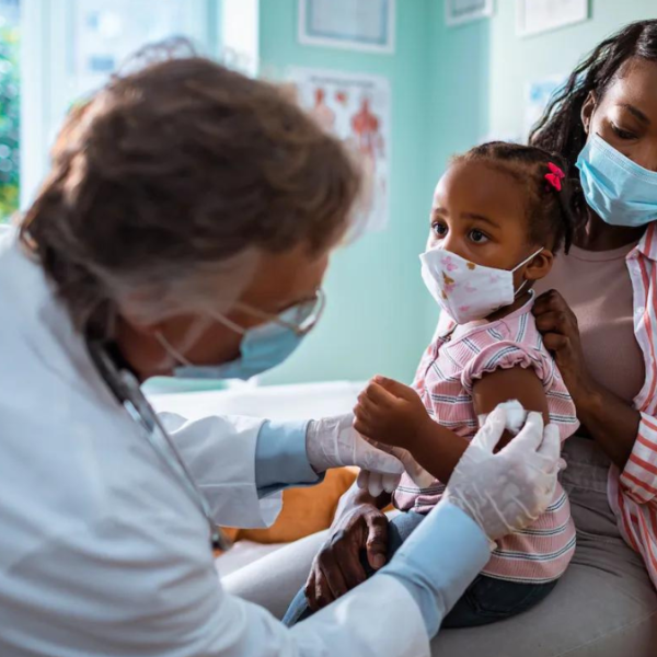 mother taking her daughter to the pediatrician to get vaccinated